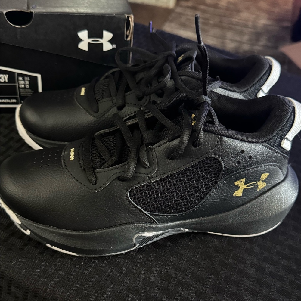 Under Armour Kids Sneakers in Black with Gold Accents